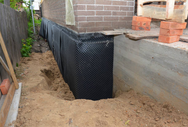 Happy homeowners after waterproofing job in Woodbury